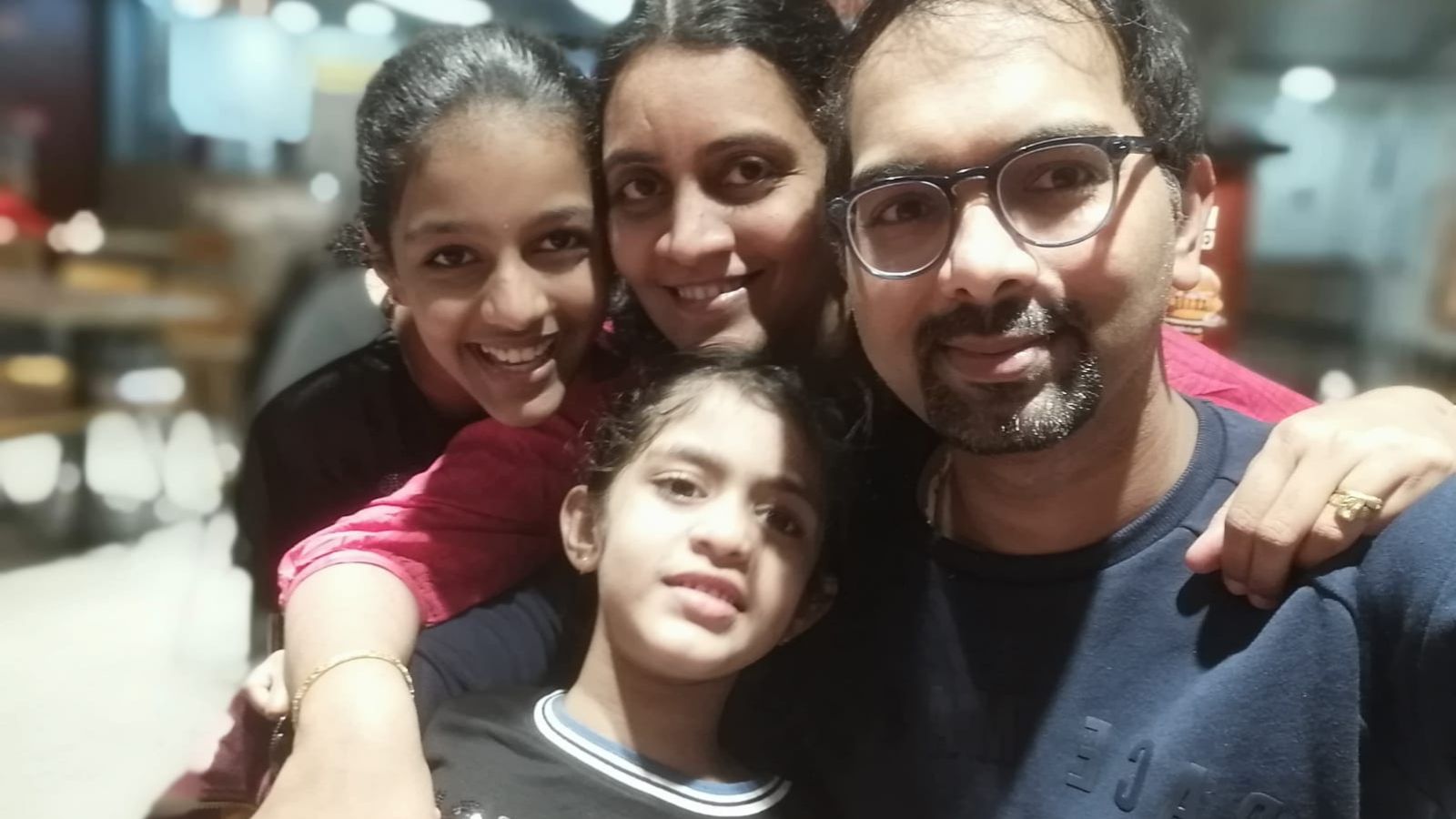 Sanvika with her elder sister, mother and father 