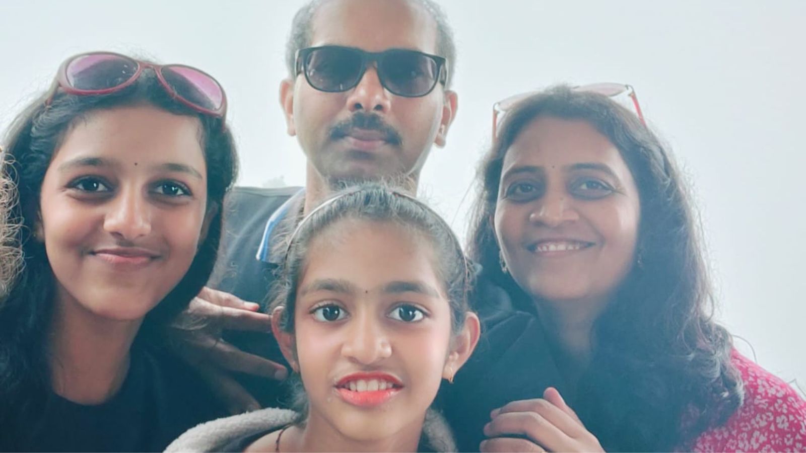 Sanvika with her elder sister, mother and father 